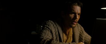 Movie still from “Sinister” (2012), directed by Scott Derrickson – A person wearing a sweater; Close Up shot, Over the shoulder angle