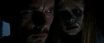 Movie still from “Sinister” (2012), directed by Scott Derrickson – A man and a woman's face; Extreme Close Up shot, Over the shoulder angle