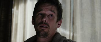 Movie still from “Sinister” (2012), directed by Scott Derrickson – A person with a beard; Close Up shot, Low angle