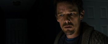 Movie still from “Sinister” (2012), directed by Scott Derrickson – A person with a beard; Close Up shot, Low angle