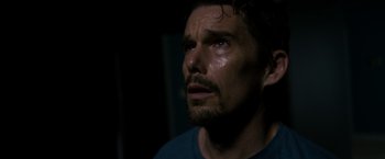 Movie still from “Sinister” (2012), directed by Scott Derrickson – A person with a beard; Close Up shot, High angle