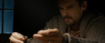 Movie still from “Sinister” (2012), directed by Scott Derrickson – A person holding a cell phone; Close Up shot, Low angle