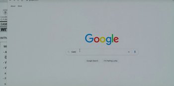 Movie still from “Smile” (2022), directed by Parker Finn – A computer screen showing a google search page; Extreme Close Up shot, High angle
