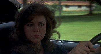 Movie still from “Smokey and the Bandit” (1977), directed by Hal Needham – A person in a car; Close Up shot, Over the shoulder angle