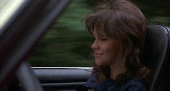 Movie still from “Smokey and the Bandit” (1977), directed by Hal Needham – A woman sitting in the passenger seat of a car; Close Up shot, Over the shoulder angle