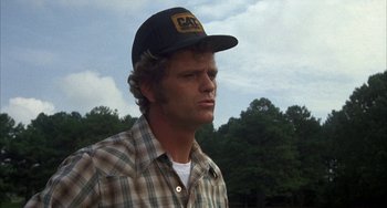 Movie still from “Smokey and the Bandit” (1977), directed by Hal Needham – A person wearing a hat; Close Up shot, Low angle