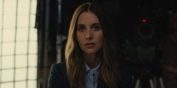 Movie still from “Somebody I Used to Know” (2023), directed by Dave Franco – A woman with long hair wearing a jacket; Close Up shot, Low angle