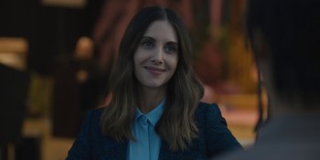 Movie still from “Somebody I Used to Know” (2023), directed by Dave Franco – A person wearing a jacket; Close Up shot, Over the shoulder angle