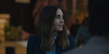 Movie still from “Somebody I Used to Know” (2023), directed by Dave Franco – A person wearing a jacket; Close Up shot, Over the shoulder angle