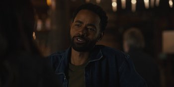 Movie still from “Somebody I Used to Know” (2023), directed by Dave Franco – A person wearing a jacket; Close Up shot, Over the shoulder angle