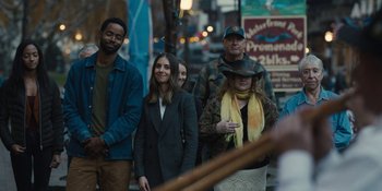 Movie still from “Somebody I Used to Know” (2023), directed by Dave Franco – A group of people walking down a street; Wide shot, Over the shoulder angle