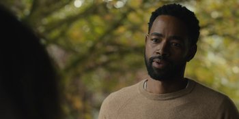 Movie still from “Somebody I Used to Know” (2023), directed by Dave Franco – A person wearing a sweater; Close Up shot, Over the shoulder angle