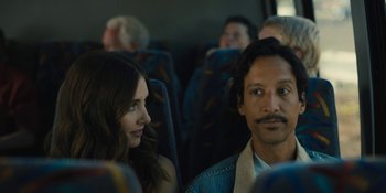Movie still from “Somebody I Used to Know” (2023), directed by Dave Franco – A man and a woman sitting on a bus together; Close Up shot, Over the shoulder angle