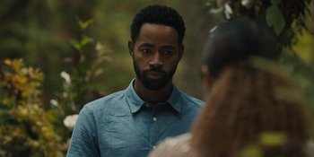 Movie still from “Somebody I Used to Know” (2023), directed by Dave Franco – A man in a blue shirt is looking at a woman; Close Up shot, Over the shoulder angle
