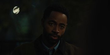 Movie still from “Somebody I Used to Know” (2023), directed by Dave Franco – A man with a beard is looking at the camera; Close Up shot, Over the shoulder angle