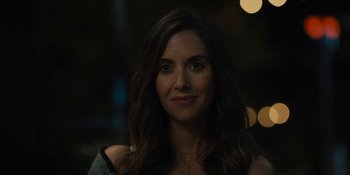 Movie still from “Somebody I Used to Know” (2023), directed by Dave Franco – A person with long hair; Close Up shot, Over the shoulder angle