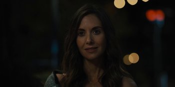 Movie still from “Somebody I Used to Know” (2023), directed by Dave Franco – A person with long hair; Close Up shot, Over the shoulder angle