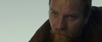 Movie still from “Son of a Gun” (2014), directed by Julius Avery – A person with a beard; Close Up shot, Over the shoulder angle