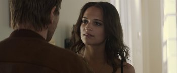 Movie still from “Son of a Gun” (2014), directed by Julius Avery – A beautiful young woman looking at a man in front of a bathroom mirror; Close Up shot, Over the shoulder angle