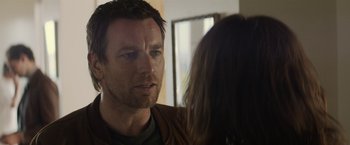 Movie still from “Son of a Gun” (2014), directed by Julius Avery – A person talking to another person; Close Up shot, Over the shoulder angle