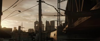 Movie still from “Son of a Gun” (2014), directed by Julius Avery – A view of a city skyline from the side of a building; Extreme Wide shot, Low angle