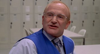 Movie still from “One Hour Photo” (2002), directed by Mark Romanek – An older man wearing glasses and a tie; Close Up shot, Low angle