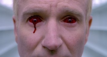 Movie still from “One Hour Photo” (2002), directed by Mark Romanek – A person's eyes with blood on them; Extreme Close Up shot, Overhead angle
