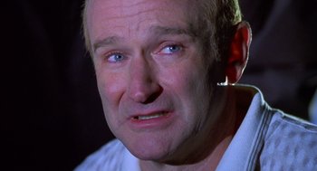Movie still from “One Hour Photo” (2002), directed by Mark Romanek – An older man with a cigarette in his mouth; Close Up shot, Low angle