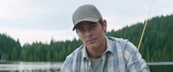 Movie still from “Sonic the Hedgehog 2” (2022), directed by Jeff Fowler – A person wearing a hat; Close Up shot, Over the shoulder angle