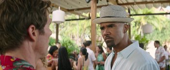 Movie still from “Sonic the Hedgehog 2” (2022), directed by Jeff Fowler – A group of people gathered at a party; Close Up shot, Over the shoulder angle