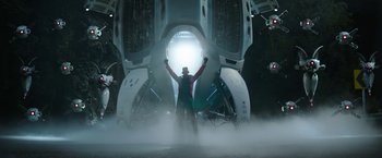 Movie still from “Sonic the Hedgehog 2” (2022), directed by Jeff Fowler – A man standing in front of an open door; Wide shot, Low angle