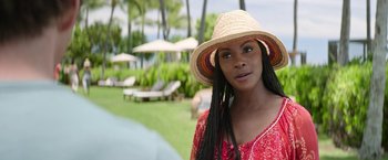 Movie still from “Sonic the Hedgehog 2” (2022), directed by Jeff Fowler – A woman in a straw hat standing in front of a pool; Close Up shot, Over the shoulder angle