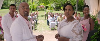 Movie still from “Sonic the Hedgehog 2” (2022), directed by Jeff Fowler – A bride and groom standing in front of a group of people; Medium shot, Over the shoulder angle