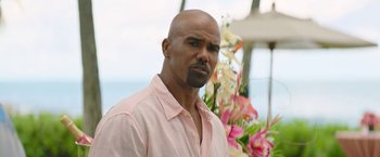 Movie still from “Sonic the Hedgehog 2” (2022), directed by Jeff Fowler – A bald man with a pink shirt is looking at the camera; Close Up shot, Over the shoulder angle