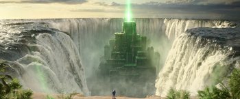 Movie still from “Sonic the Hedgehog 2” (2022), directed by Jeff Fowler – A man standing in front of a large waterfall; Extreme Wide shot, Low angle