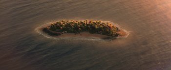 Movie still from “Sonic the Hedgehog 2” (2022), directed by Jeff Fowler – An aerial view of an island in the middle of the ocean; Extreme Wide shot, Overhead angle