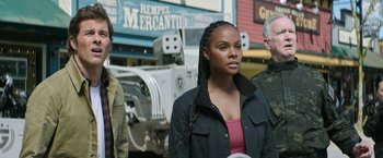 Movie still from “Sonic the Hedgehog 2” (2022), directed by Jeff Fowler – A woman standing next to two other people; Medium shot, Low angle