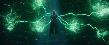 Movie still from “Sonic the Hedgehog 2” (2022), directed by Jeff Fowler – A man standing in front of a bunch of green lights; Wide shot, Low angle