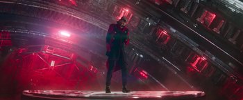 Movie still from “Sonic the Hedgehog 2” (2022), directed by Jeff Fowler – A man standing on a platform in a futuristic setting; Wide shot, Low angle