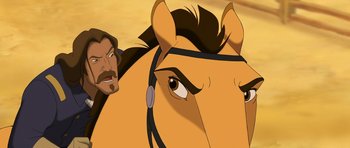 Movie still from “Spirit: Stallion of the Cimarron” (2002), directed by Lorna Cook – A horse's face with a man in the background; Close Up shot, Over the shoulder angle