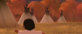 Movie still from “Spirit: Stallion of the Cimarron” (2002), directed by Lorna Cook – A person sitting in front of teepees in a field; Extreme Wide shot, Over the shoulder angle