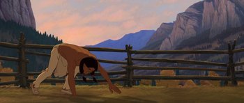 Movie still from “Spirit: Stallion of the Cimarron” (2002), directed by Lorna Cook – An animated picture of a person bending over; Wide shot, Low angle