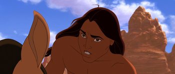 Movie still from “Spirit: Stallion of the Cimarron” (2002), directed by Lorna Cook – An animated man with long black hair is looking at the camera; Close Up shot, Low angle