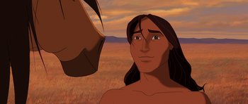 Movie still from “Spirit: Stallion of the Cimarron” (2002), directed by Lorna Cook – An animated picture of a man and a horse; Close Up shot, Over the shoulder angle