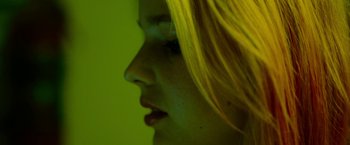 Movie still from “Spring Breakers” (2012), directed by Harmony Korine – A person with yellow hair; Extreme Close Up shot, Overhead angle