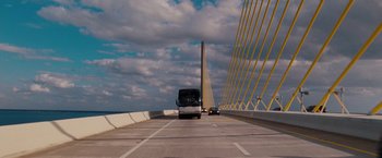 Movie still from “Spring Breakers” (2012), directed by Harmony Korine – A double decker bus driving on a bridge; Extreme Wide shot, High angle