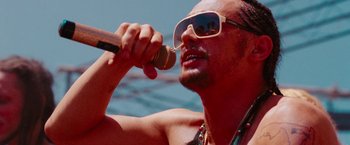 Movie still from “Spring Breakers” (2012), directed by Harmony Korine – A man with a microphone in his mouth; Close Up shot, Low angle