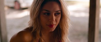 Movie still from “Spring Breakers” (2012), directed by Harmony Korine – A person with long hair; Close Up shot, Over the shoulder angle