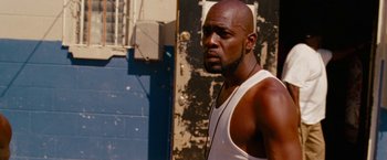 Movie still from “Spring Breakers” (2012), directed by Harmony Korine – A man with a beard is listening to music; Close Up shot, Low angle