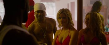 Movie still from “Spring Breakers” (2012), directed by Harmony Korine – A woman in a red bikini and a man in a white hat; Close Up shot, Over the shoulder angle